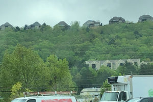 Picture of houses on the top of a mountain.