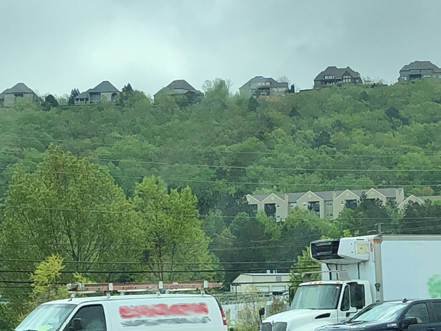 Picture of houses on the top of a mountain.
