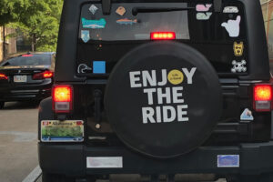 Spare tire cover reminding me to enjoy the ride.