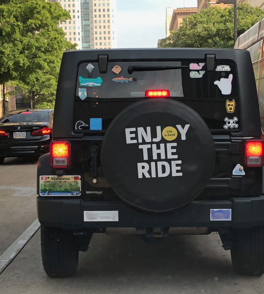 Spare tire cover reminding me to enjoy the ride.