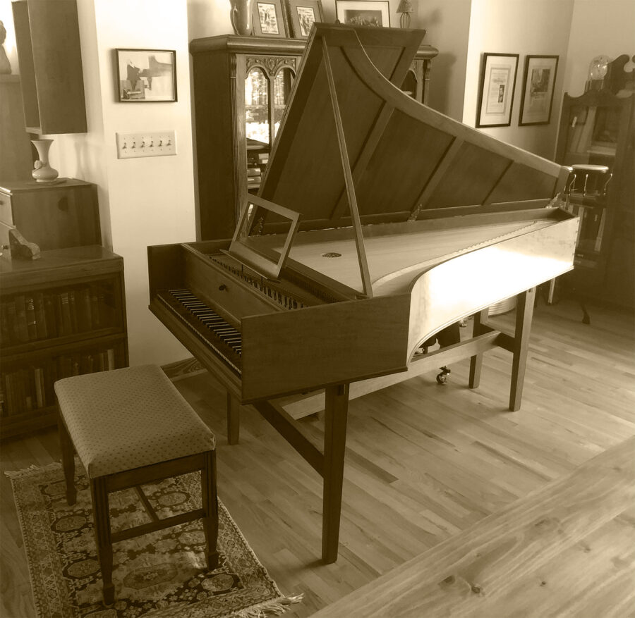 Sepia photo of harpsichord.