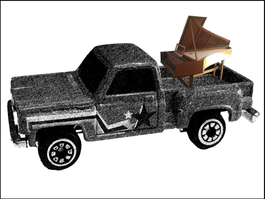 Harpsichord on back of pickup truck.