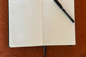 photo of a blank journal and pen